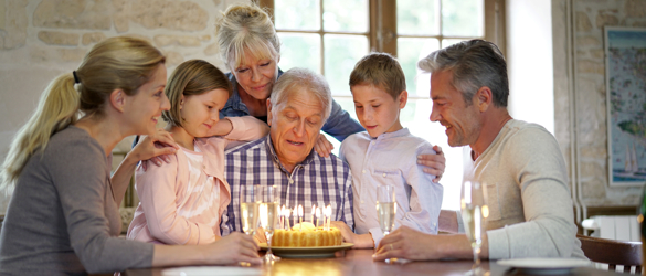 Family celebrating with cake