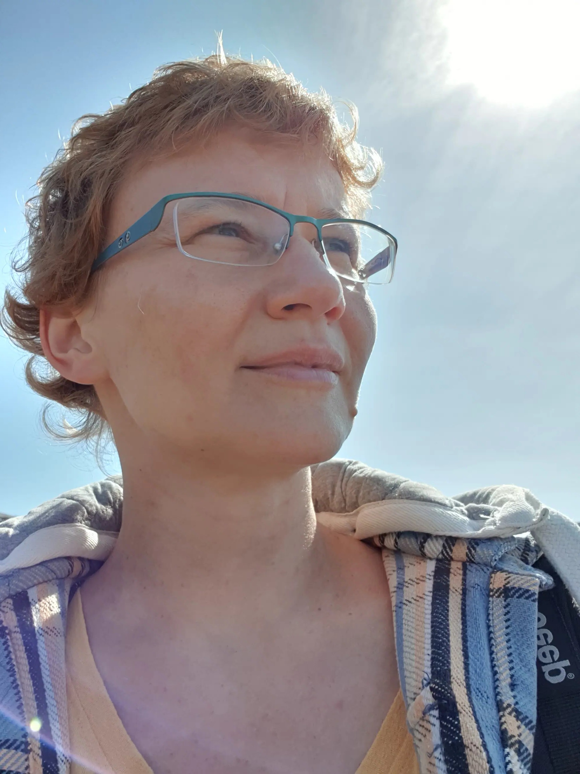 Close up headshot of Dr Agata a middle aged white woman with short blonde hair and glasses 