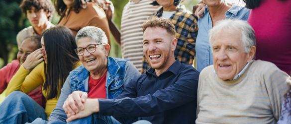 Group of people of mixed ages and races laughing together