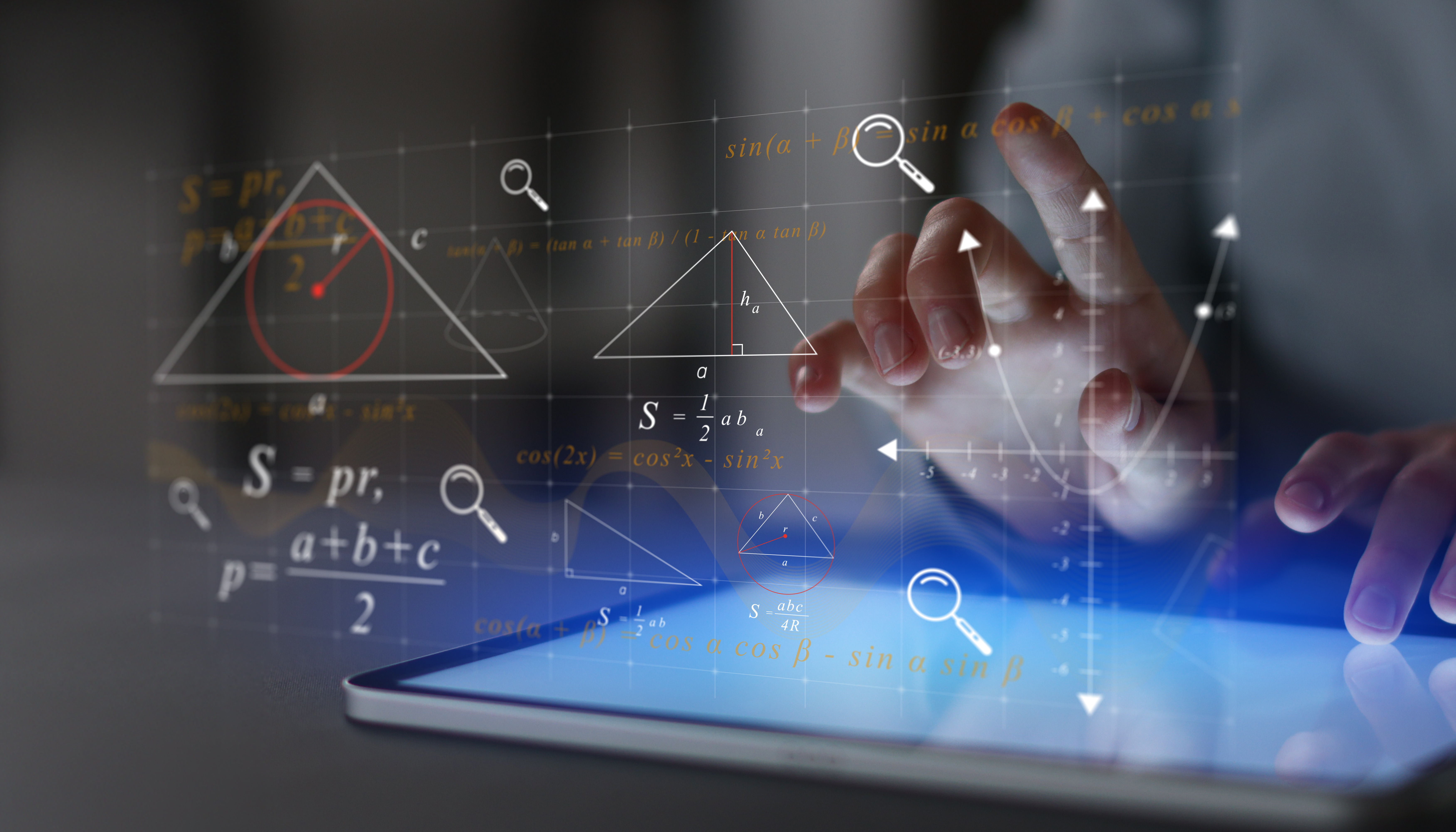 Screen with mathematical equations and symbols coming out of it and hands typing