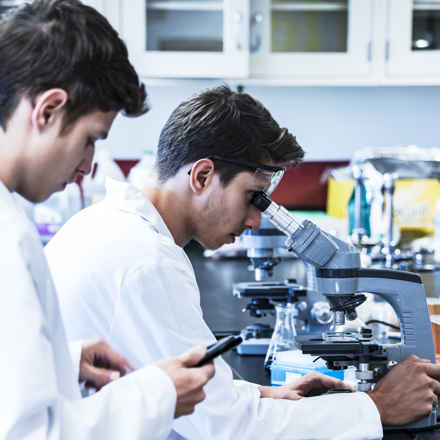 scientific research laboratory with two male researchers