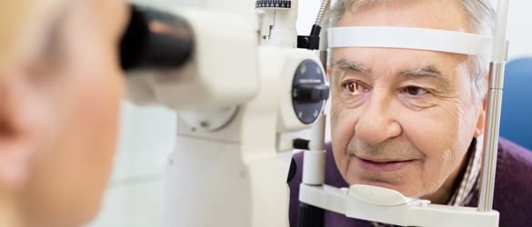 Image of an elderly man getting an eye scan