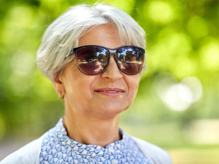 Lady outside wearing sunglasses