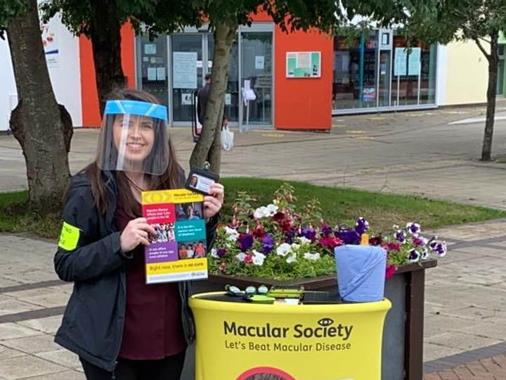 Face-to-face fundraiser in street with stand and with social distancing measures