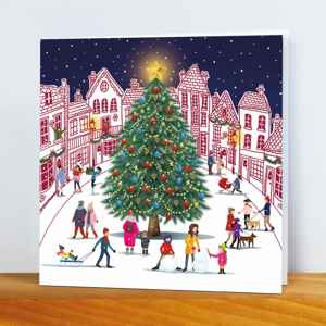 Christmas card of a beautiful Christmas tree in the middle of a town square as families enjoy the snow displayed on a mantle