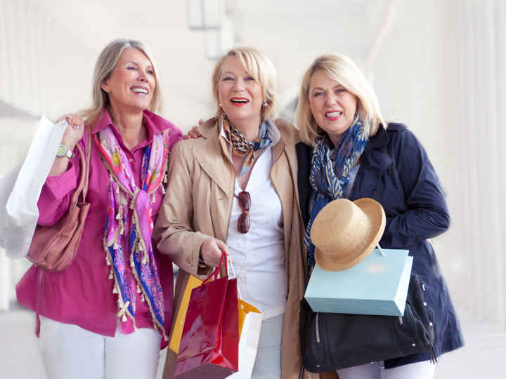 Three women with shopping bags