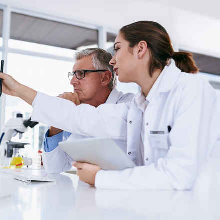 Medical research working together on a computer