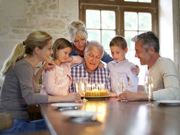 Family celebrating with cake