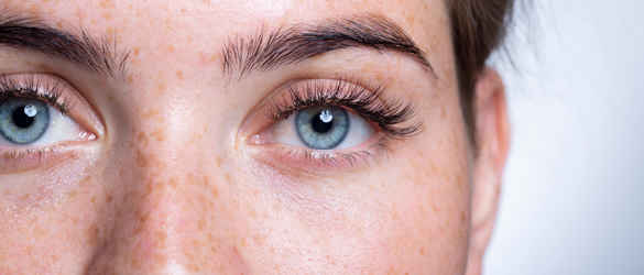 Close up on a woman's bright, young face