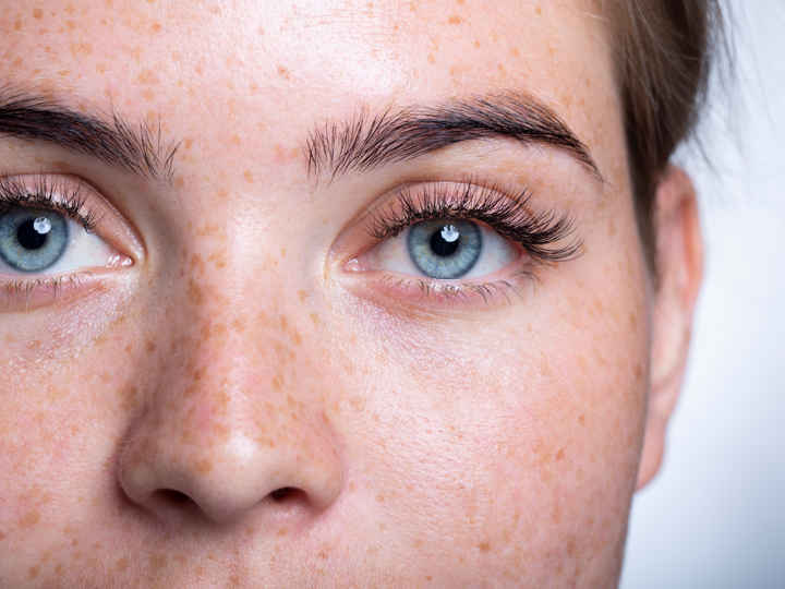 Close up on a woman's bright, young face