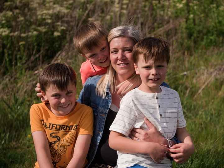 Kelly and her sons in a field