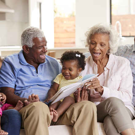 Multi-generational family reading together