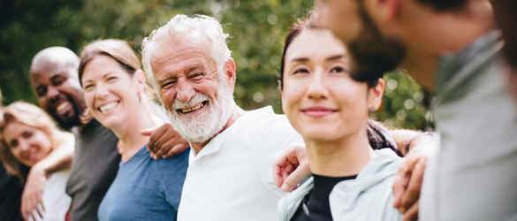 People Smiling arms around each other