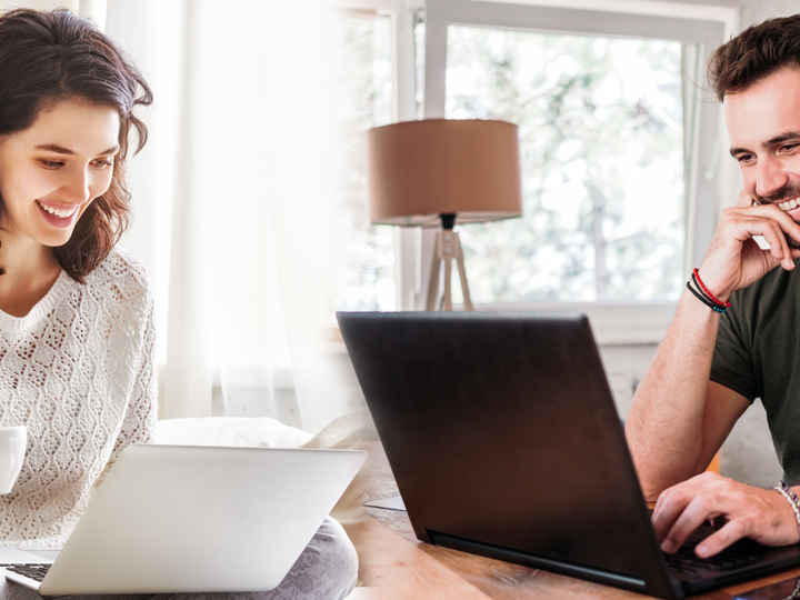 Young lady and young man laughing and talking online