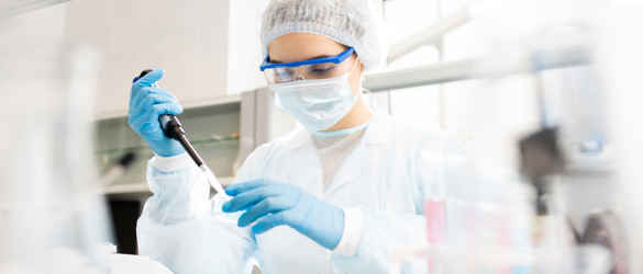 micro biologist with petri dish