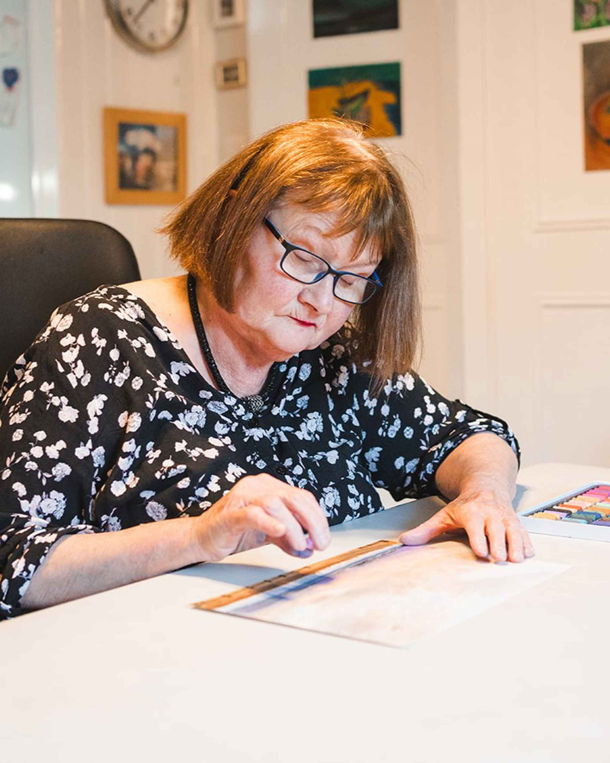 Anne drawing a picture with chalk pastels