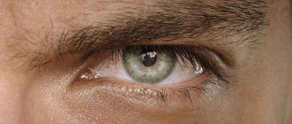 Man with green eyes close up