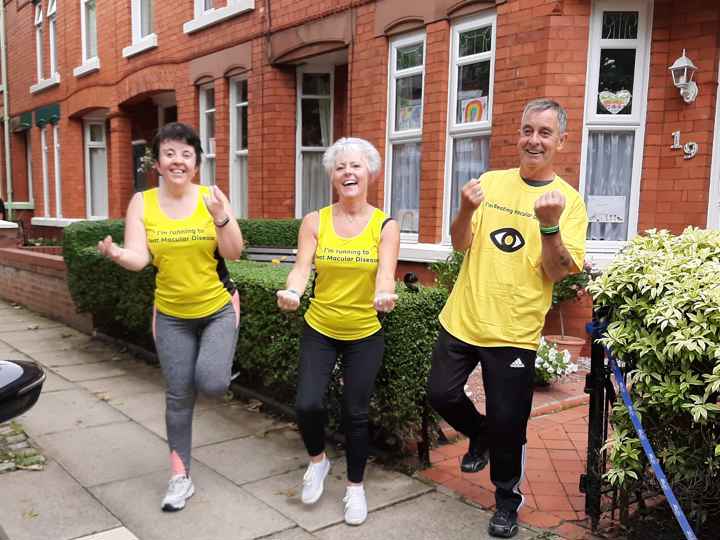 Lee Family in yellow tops, outside house