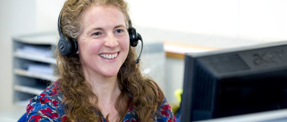 staff member on phone smiling