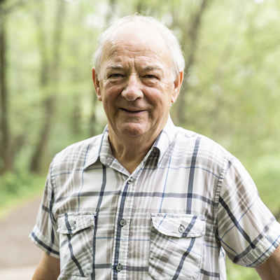 Elderly man smiling outside