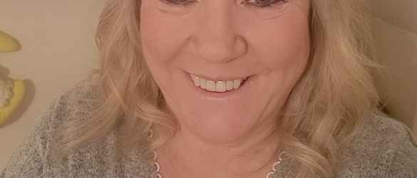 Denise Lewis smiling at camera