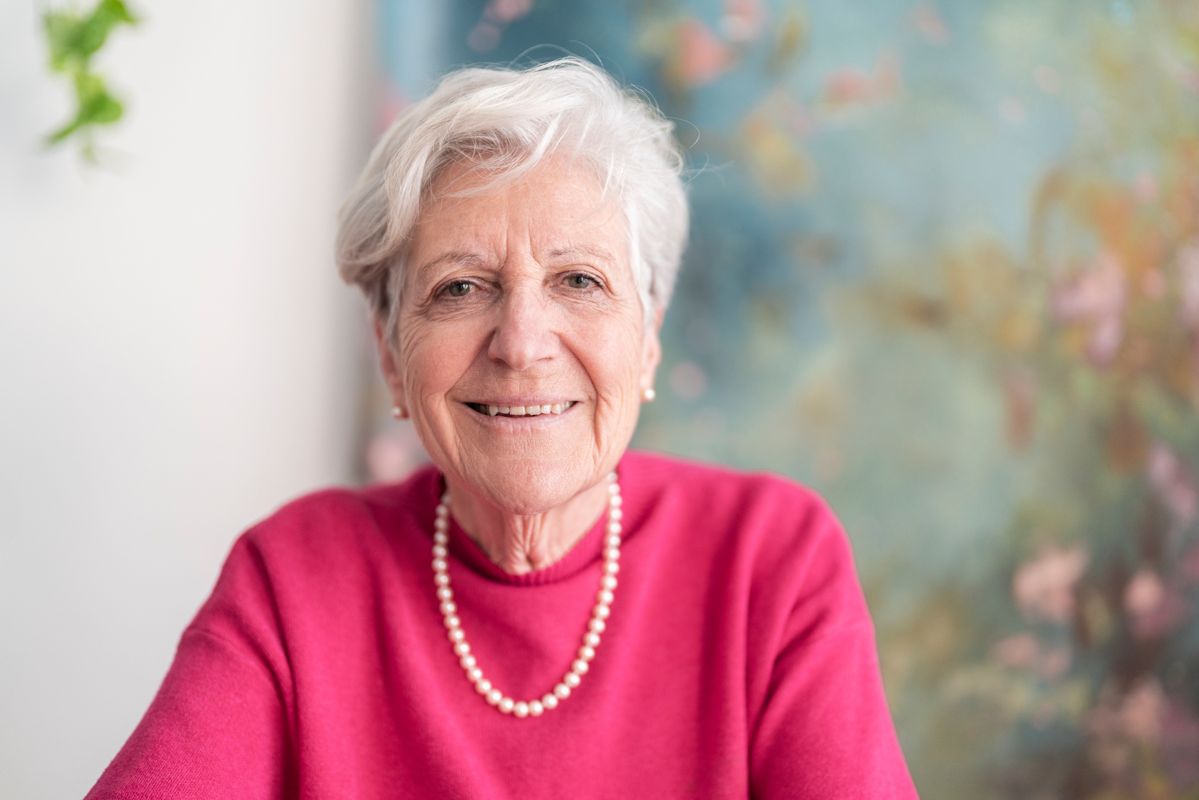 Older woman smilling and looking to camera