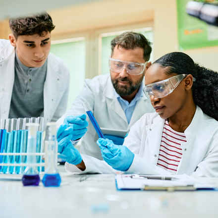 Multi-racial team of researchers working in lab