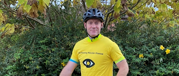 Simon Jones in Macular Society top, with cycle.