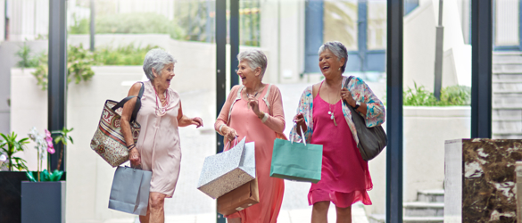 three women shopping and laughing