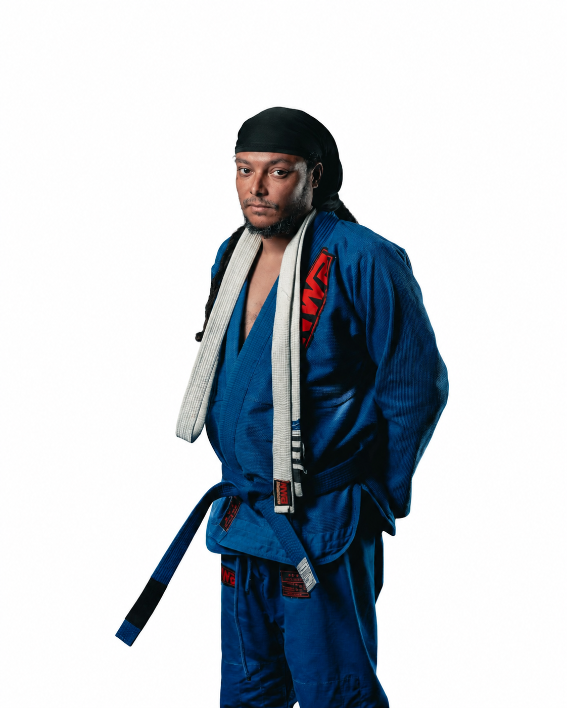 Matt, a black man in his 30s, wearing his Brazilian Jiu Jitsu costume, a dark blue robe and black head bandana 