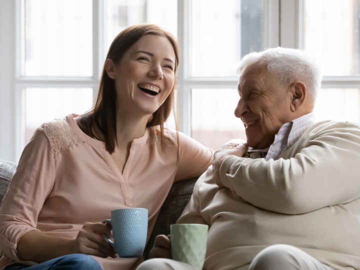 Grandaughter Grandfather Laughing Together